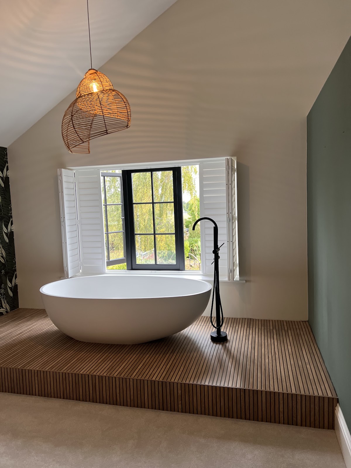 A spotless bathroom with a freestanding bath cleaned by Fresh Daisy