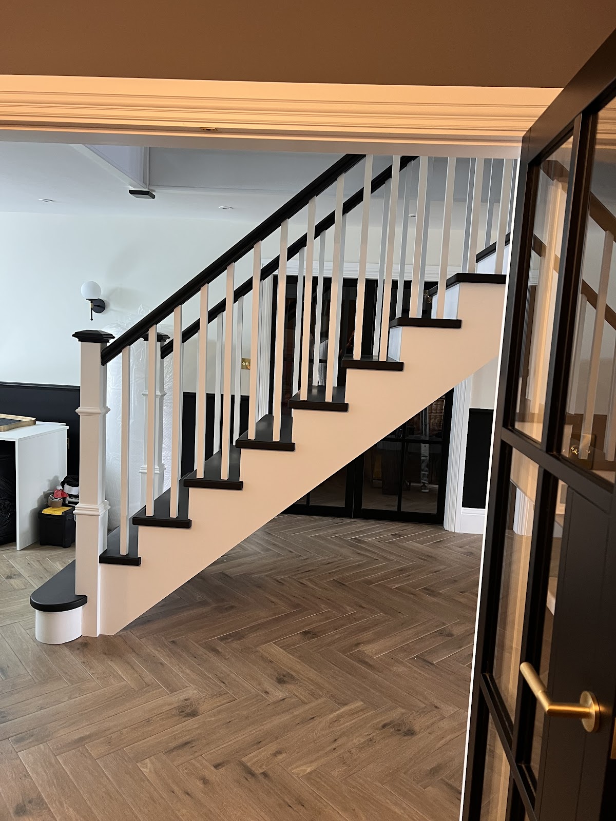 Freshly cleaned staircase and herringbone hallway